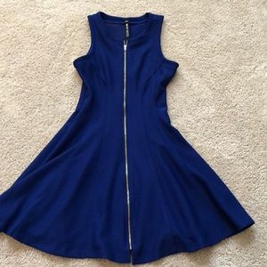 blue dress with gold zipper going up the front